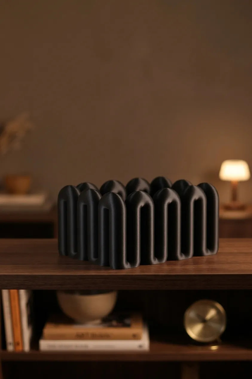 Black Wibble open-top storage box displayed on a dark wooden shelf