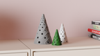 Wisp Christmas tree LED tealight shade in a festive tabletop display