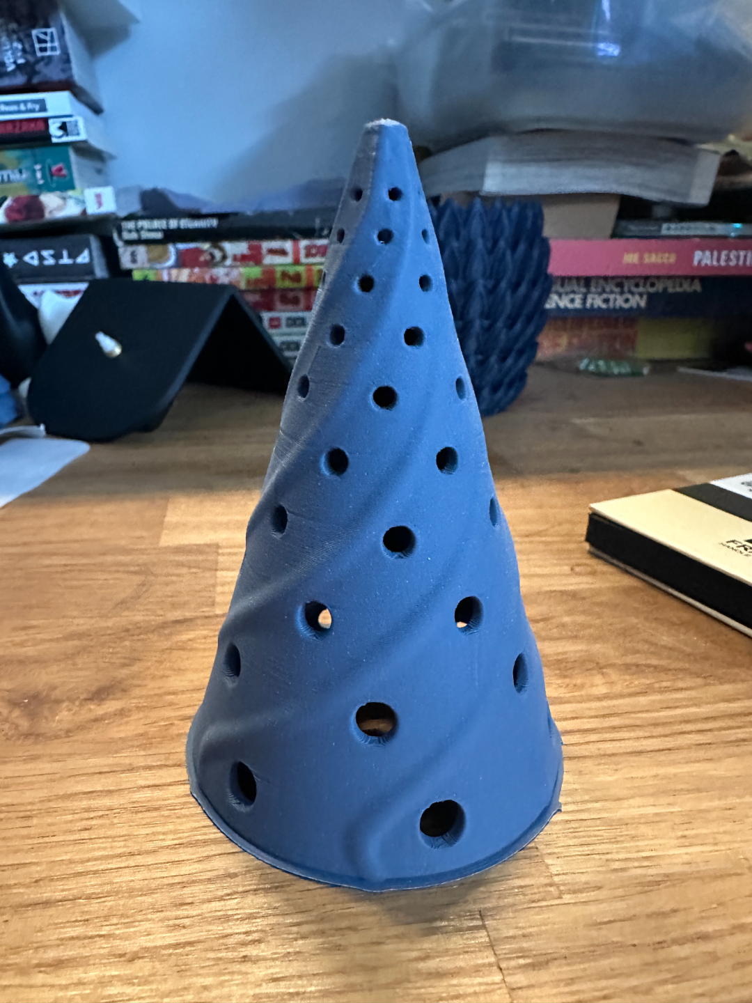 Wisp Christmas tree LED tealight shade in blue on a table